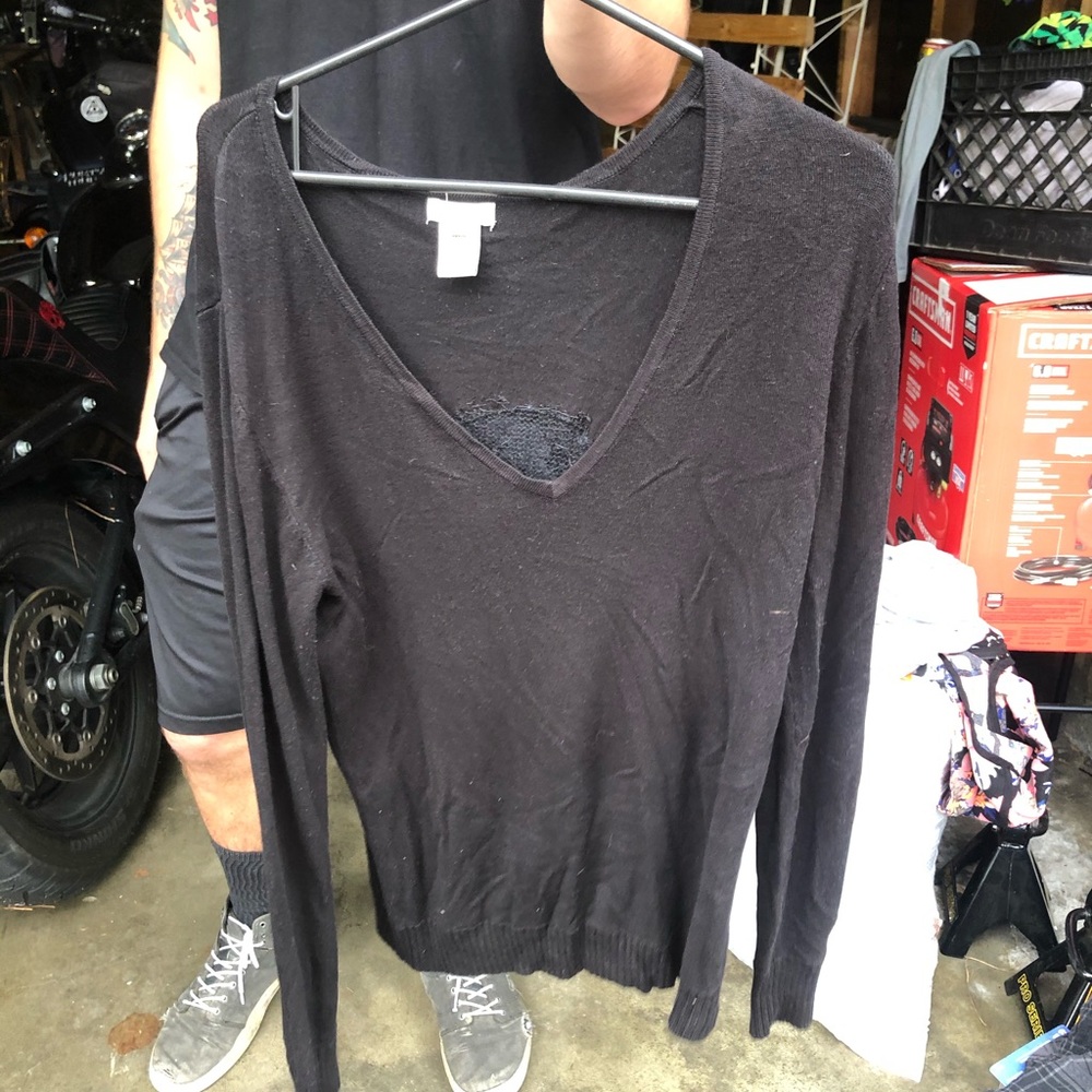 Black sweater with design on back